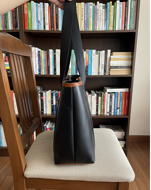 black tote bag with handheld